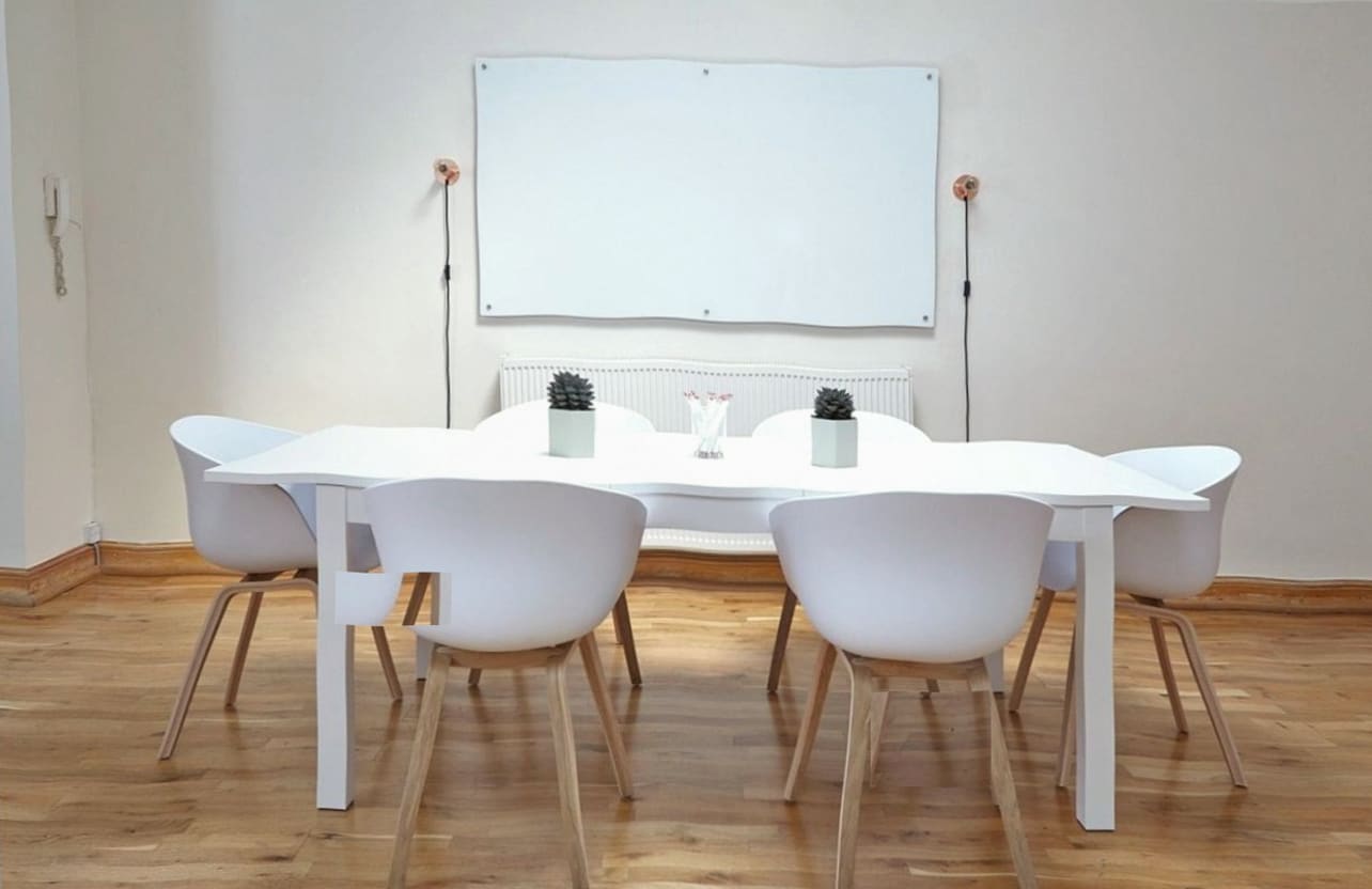 Round dining table in reclaimed timber
